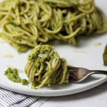 Forkful of twirled spaghetti with asparagus pesto