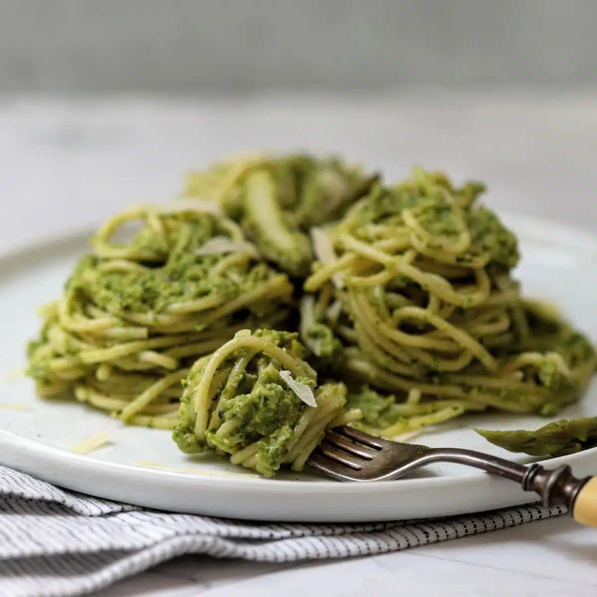 Plate of spaghetti with asparagus pesto. 