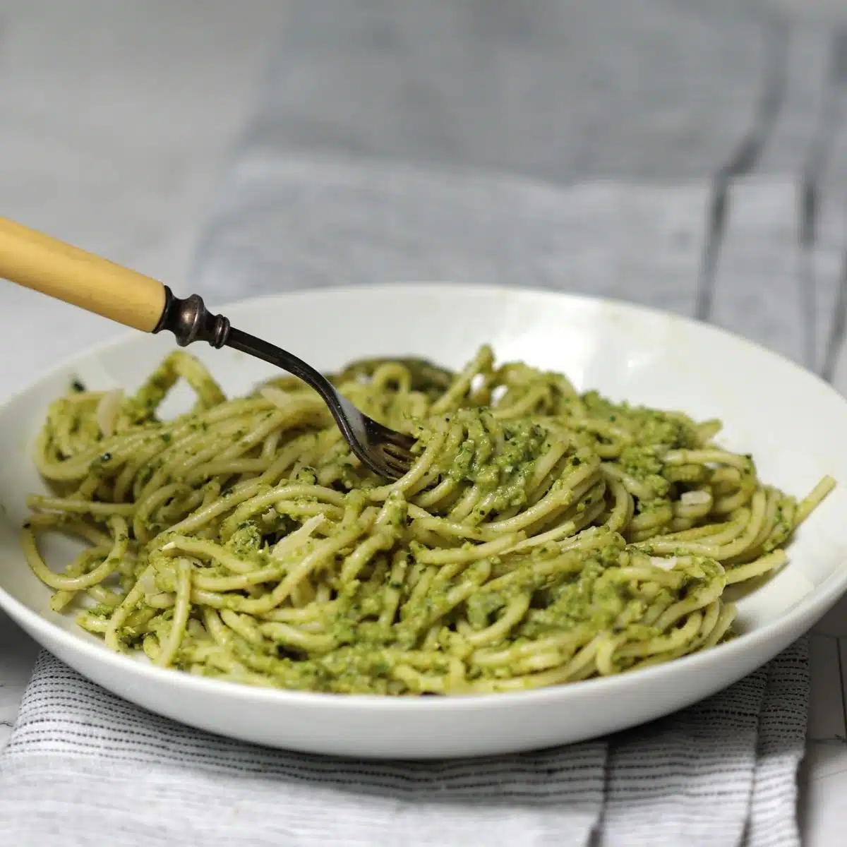 Plate with asparagus pesto and spaghetti.