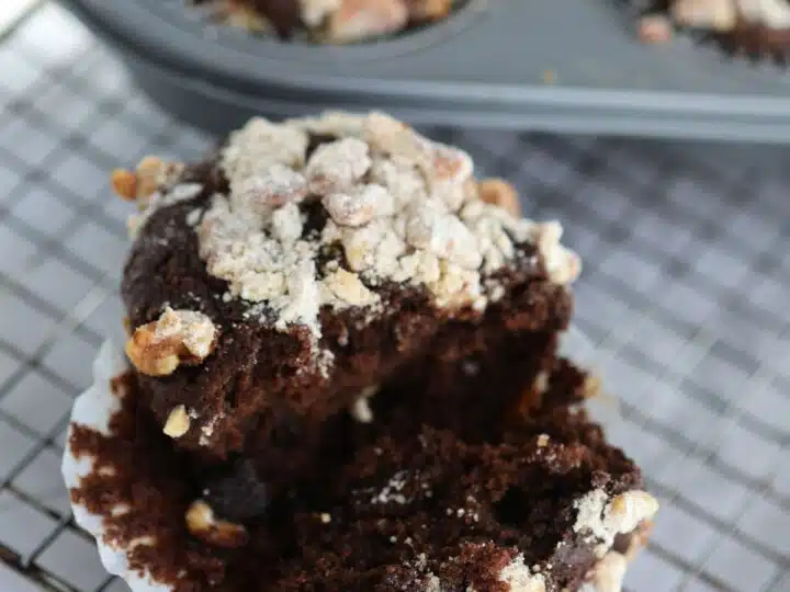 Chocolate streusel muffin split open.