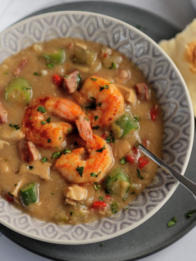 bowl shrimp and sausage gumbo with spoon