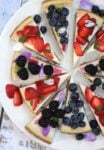 Slices of lemon cheesecake with mixed berries ( blueberry, blackberry and strawberry) topping