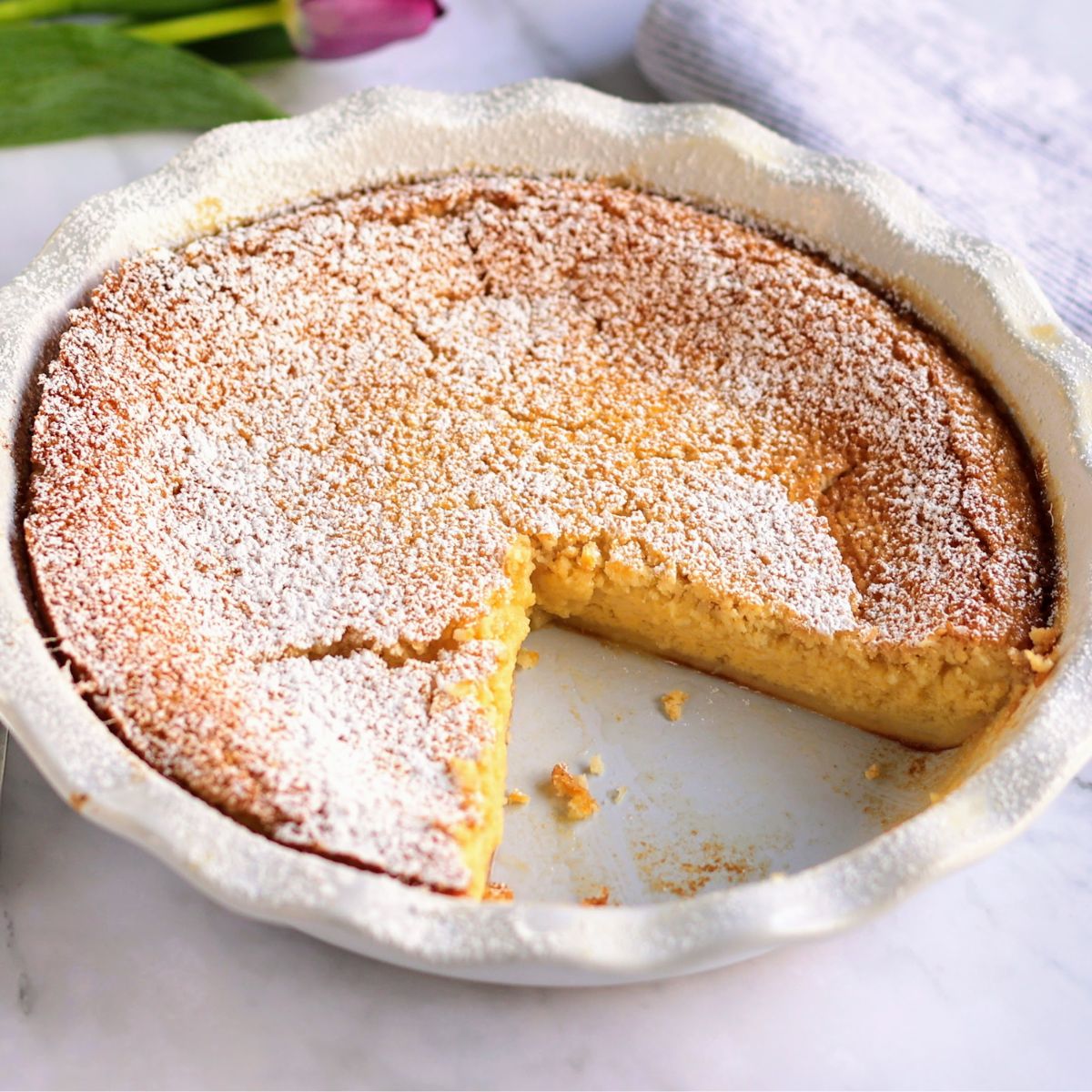 Lemon Impossible Pie with slice out.