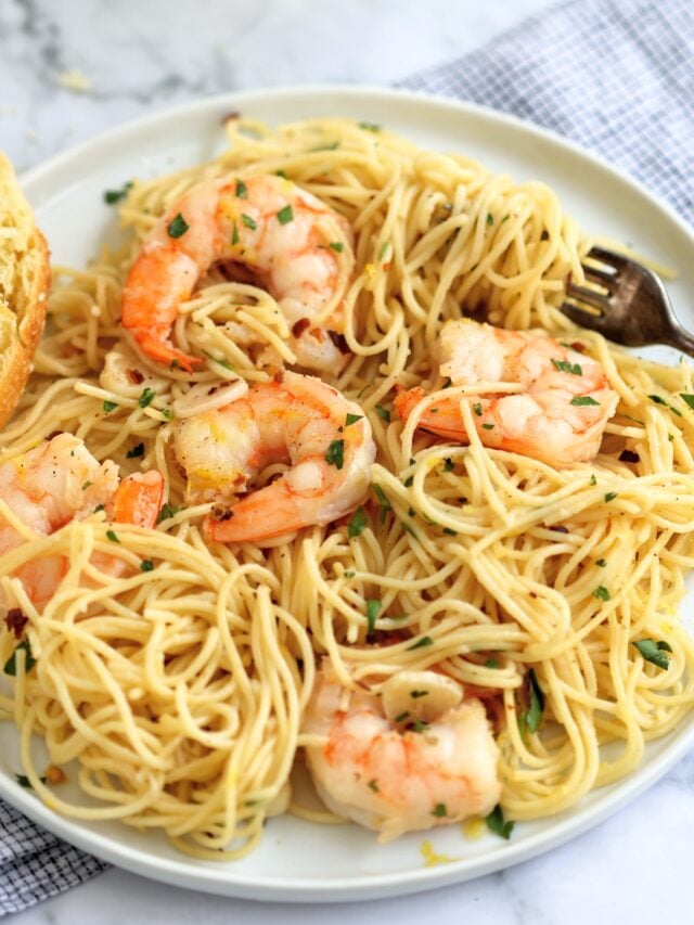 plate of garlicky shrimp scampi with angel hair pasta