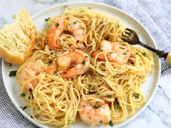 plate of garlicky shrimp scampi with angel hair pasta