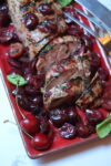 Slices of Pork Tenderloin with Cherry Sauce on a platter