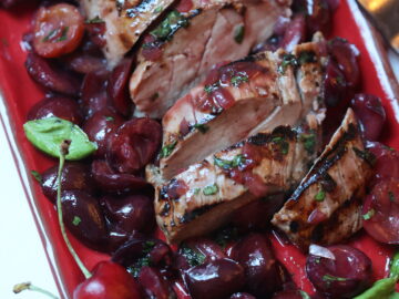 Slices of Pork Tenderloin with Cherry Sauce on a platter