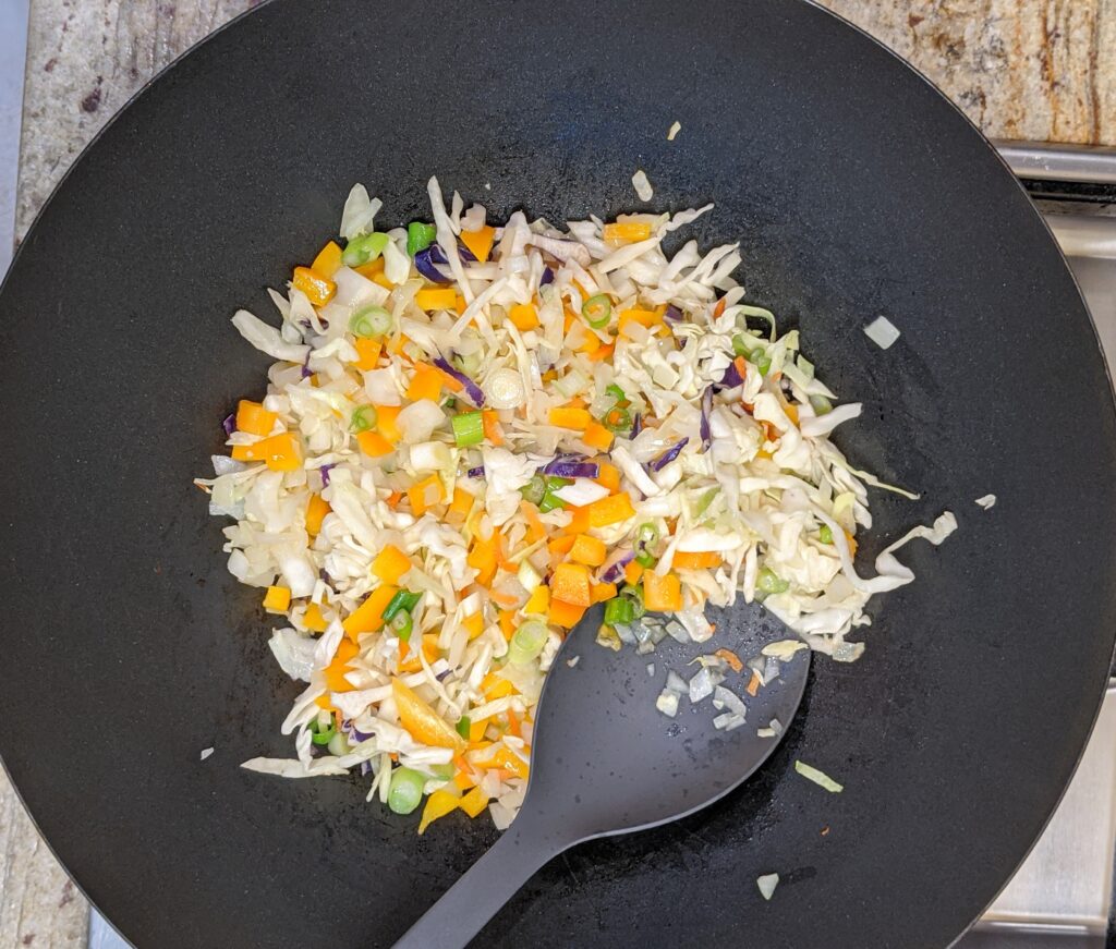 uncooked veggies in a wok