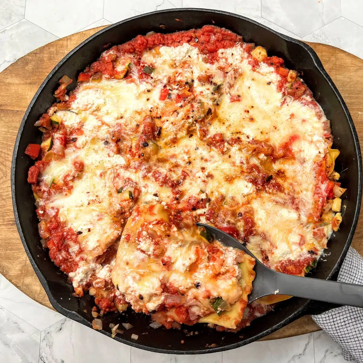 Cast iron pan with skillet vegetable lasagna.