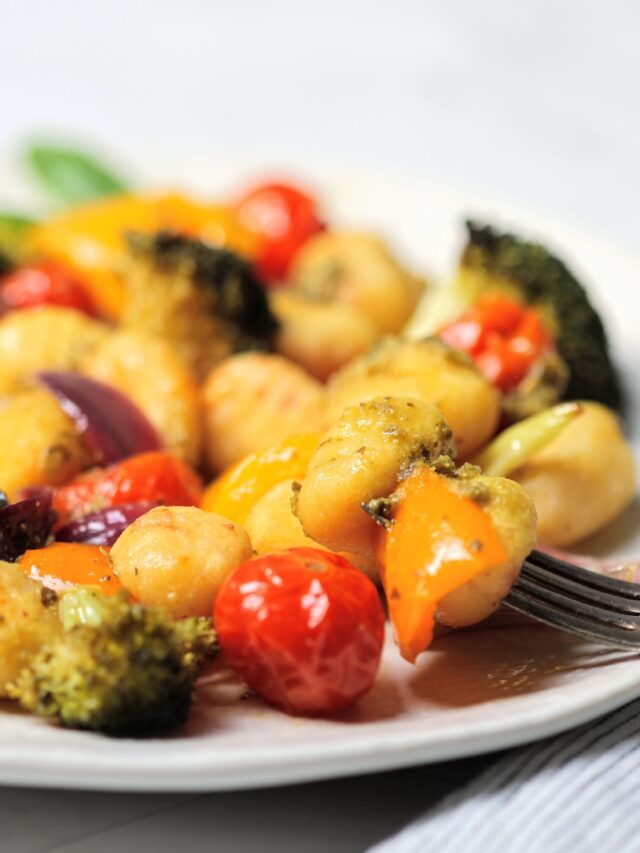 Plate of Gnocchi with roasted vegetables and pesto