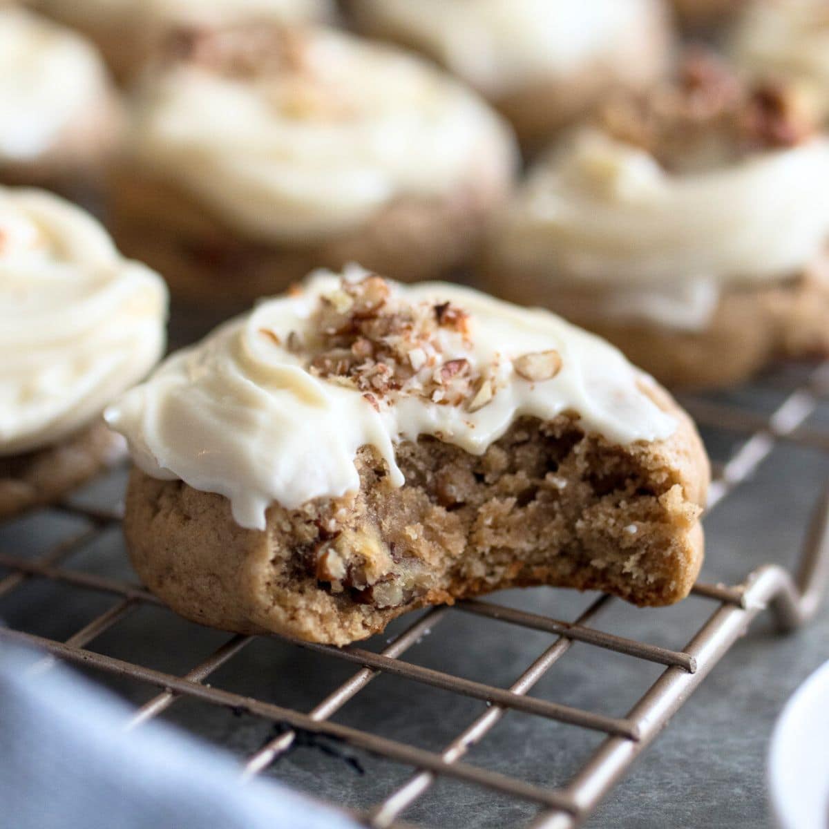 Banana Bread cookie with bite out on wire rack.
