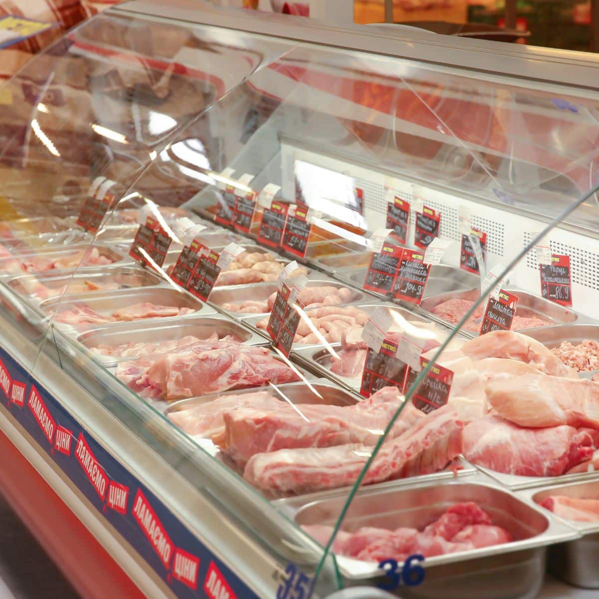 Meat case in grocery store.