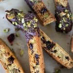 Pile of Chocolate Dipped Cherry and Pistachio Biscotti.