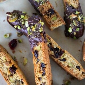 Pile of Chocolate Dipped Cherry and Pistachio Biscotti.