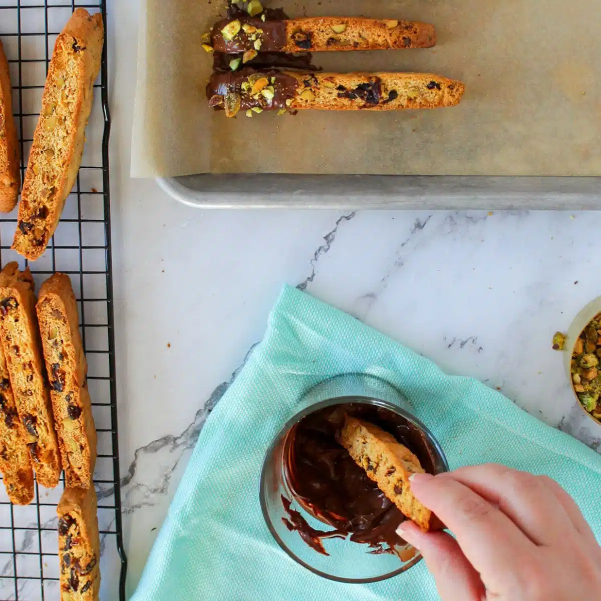dipping biscotti in chocolate.