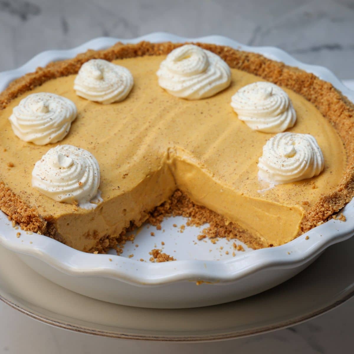 no bake pumpkin pie with slices out.