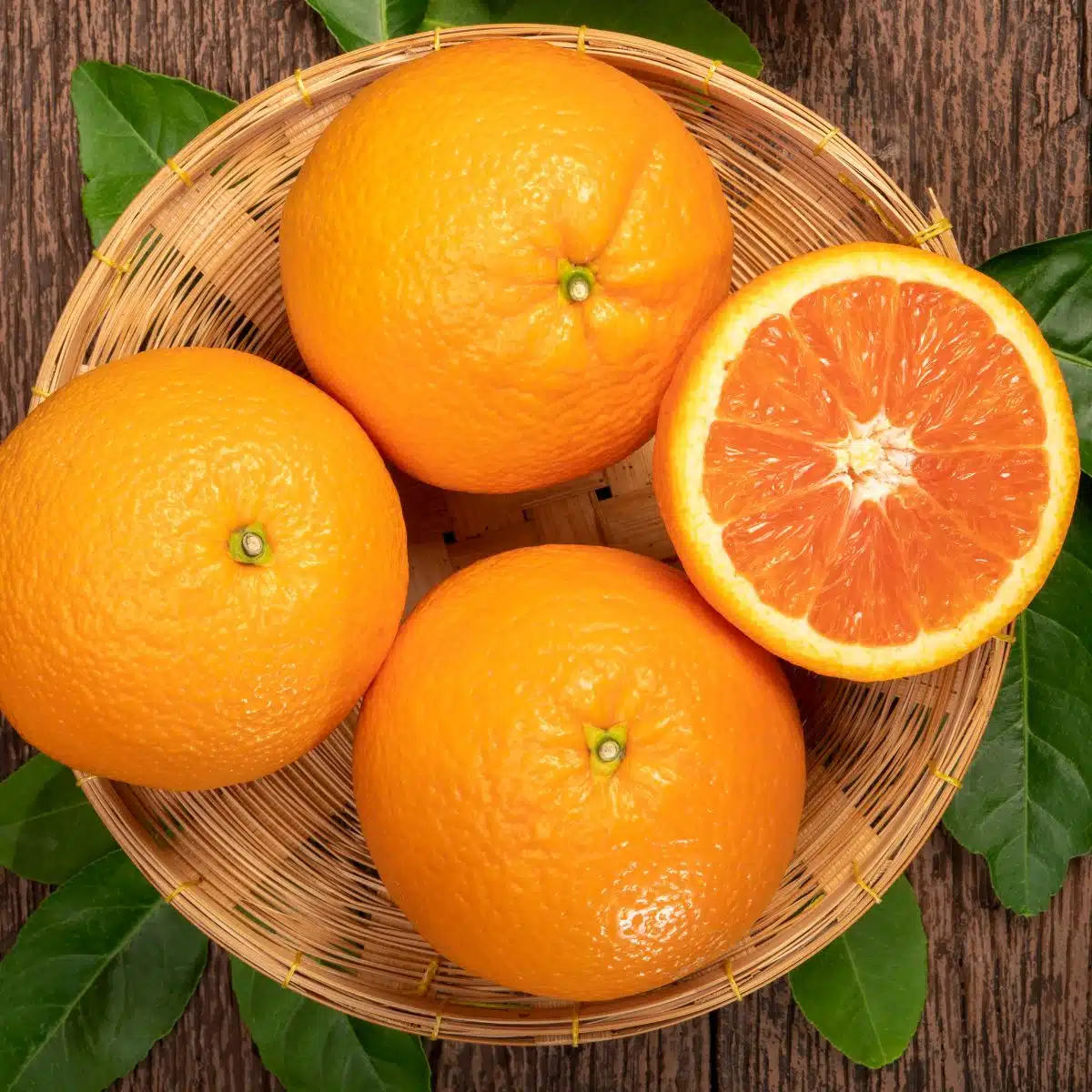 Cara Cara oranges with one cut in half. 