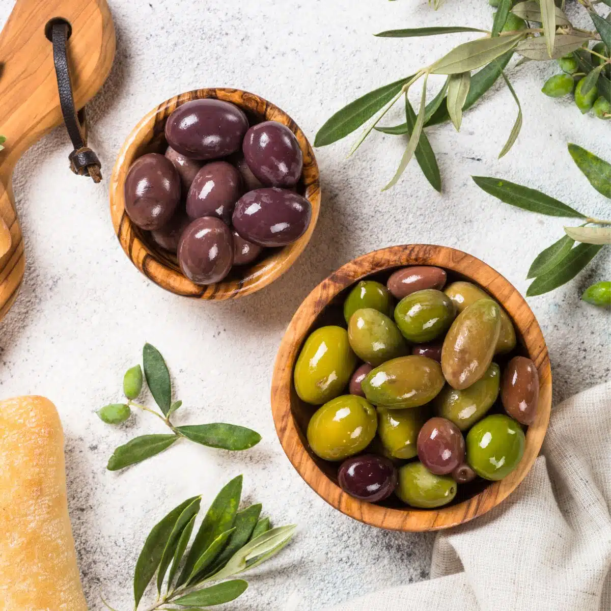Wooden bowls with olives.