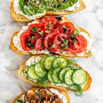 Cottage cheese toast topped tomatoes, cucumbers, and avocados.
