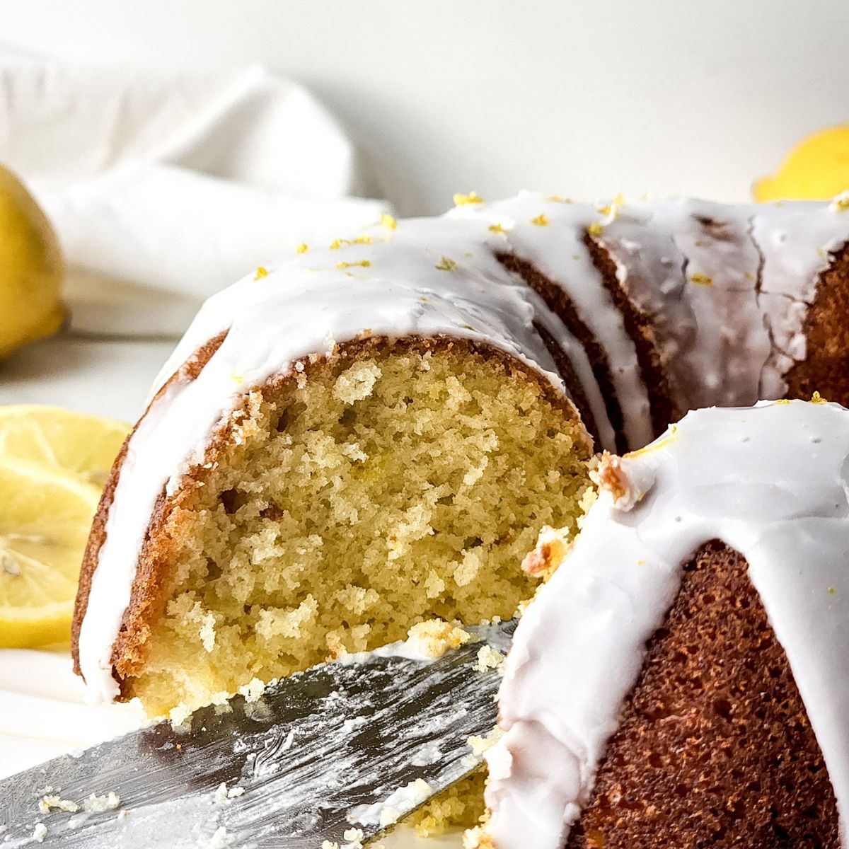 Lemon bundt cake with slice removed.