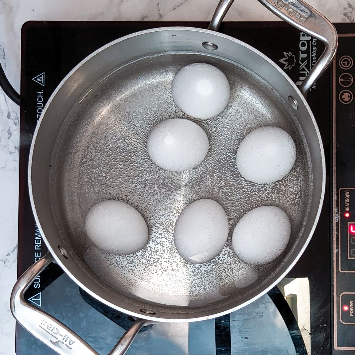 Eggs cooking in pan. 
