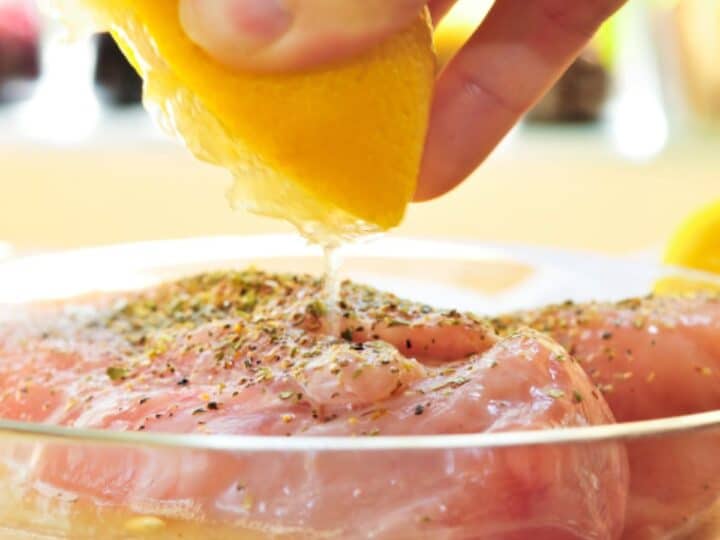 How to marinate: squeezing lemon over chicken.