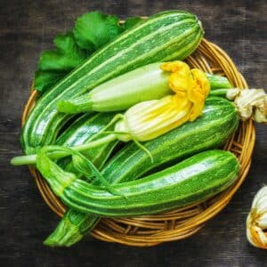 Bowl wth zucchini and zucchini blossoms